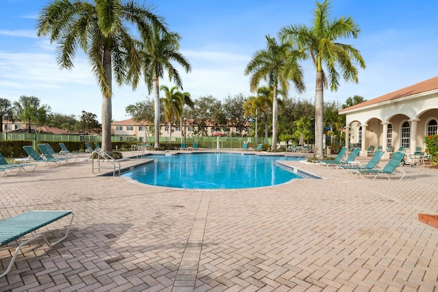 view of swimming pool with a patio