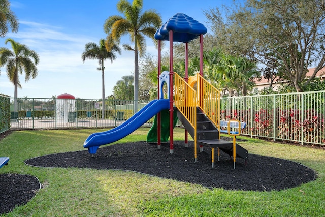 view of playground with a lawn