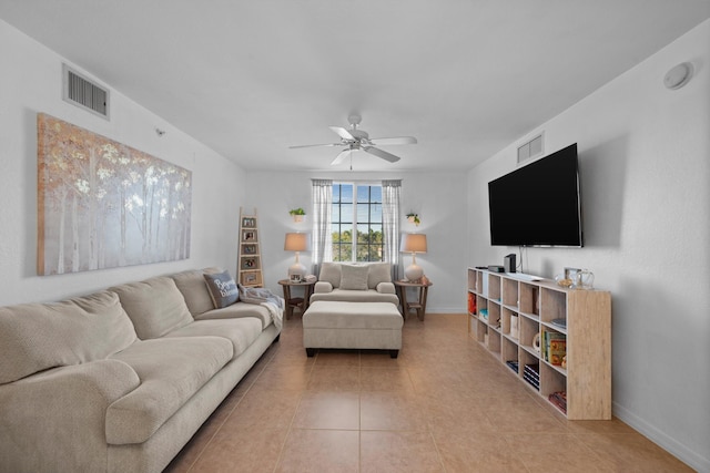 living room with light tile patterned flooring and ceiling fan