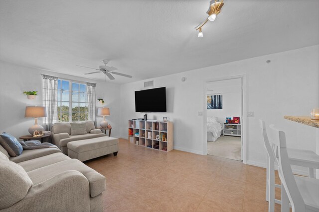 living room featuring ceiling fan