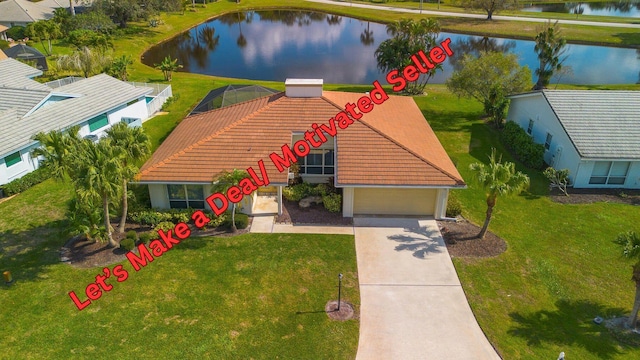 birds eye view of property featuring a water view