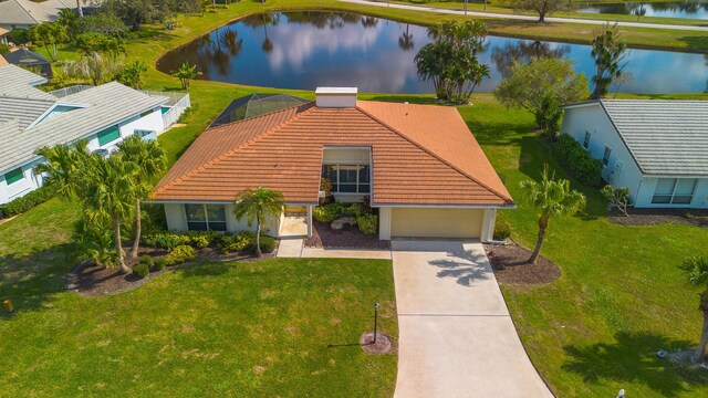 birds eye view of property featuring a water view