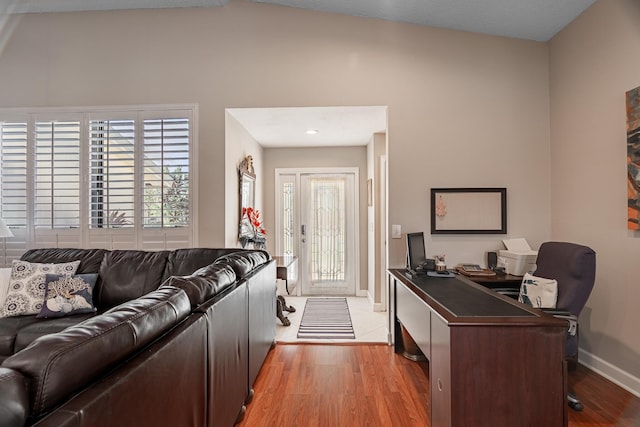 office featuring baseboards and light wood finished floors
