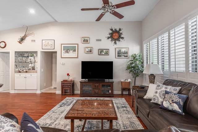 living room featuring lofted ceiling, hardwood / wood-style floors, and ceiling fan