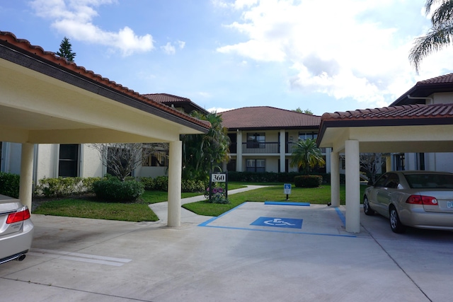 view of car parking with a yard