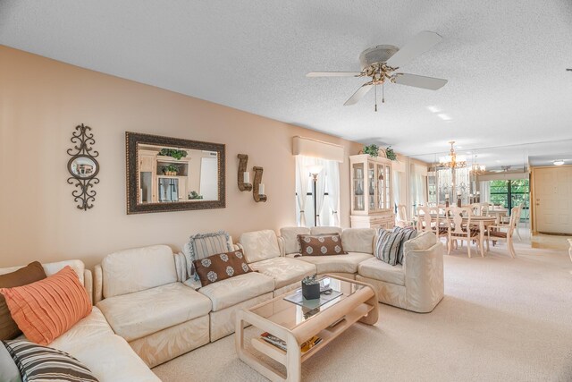 carpeted living room featuring ceiling fan