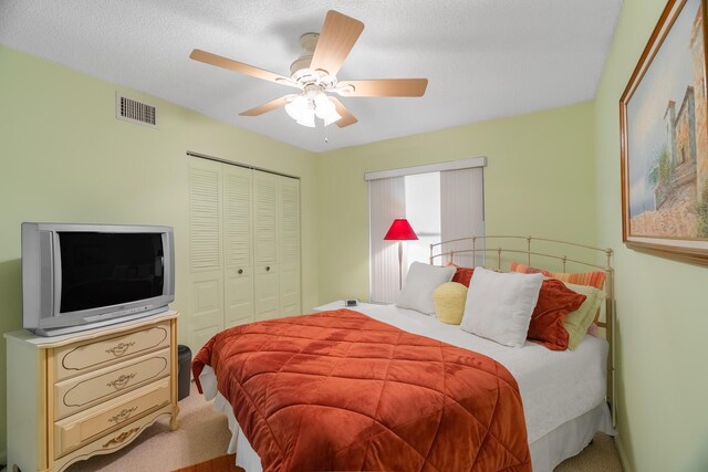 bedroom with ceiling fan and carpet floors