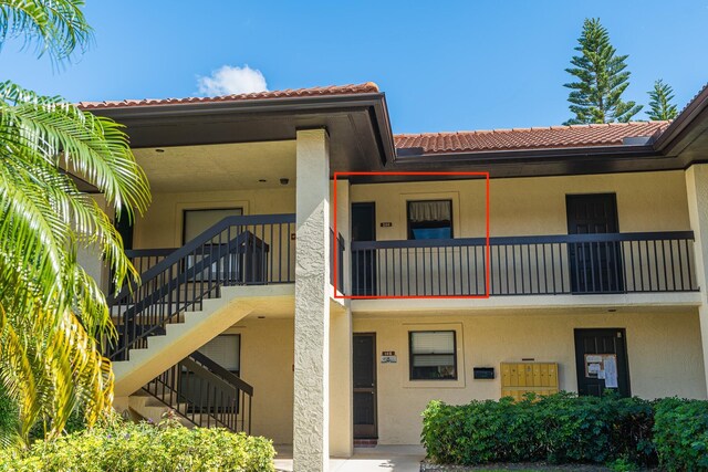 doorway to property featuring a balcony