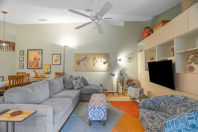 living room featuring high vaulted ceiling and ceiling fan