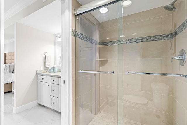 bathroom with tile patterned flooring, vanity, and walk in shower