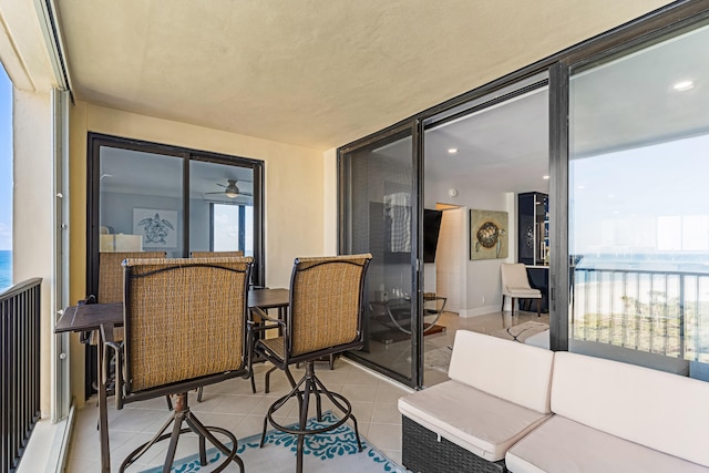 interior space with a water view and outdoor lounge area