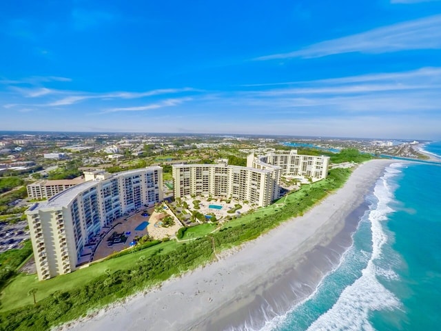 aerial view featuring a view of the beach and a water view