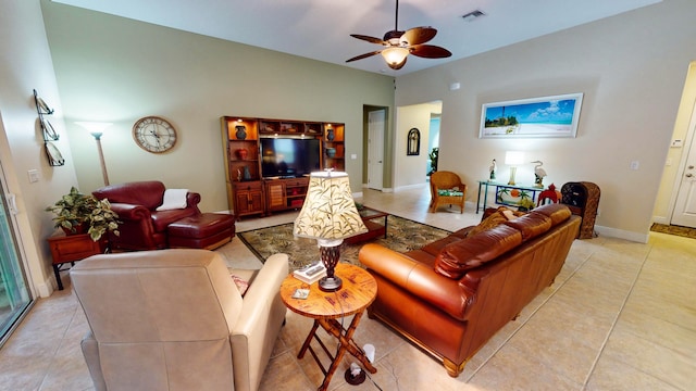 tiled living room featuring ceiling fan