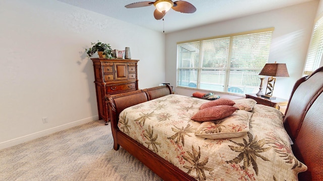 bedroom with light carpet and ceiling fan