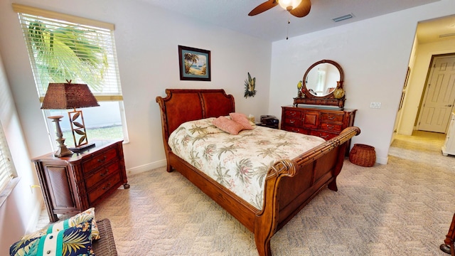 bedroom featuring ceiling fan and light colored carpet