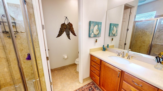 bathroom with vanity, an enclosed shower, tile patterned floors, and toilet