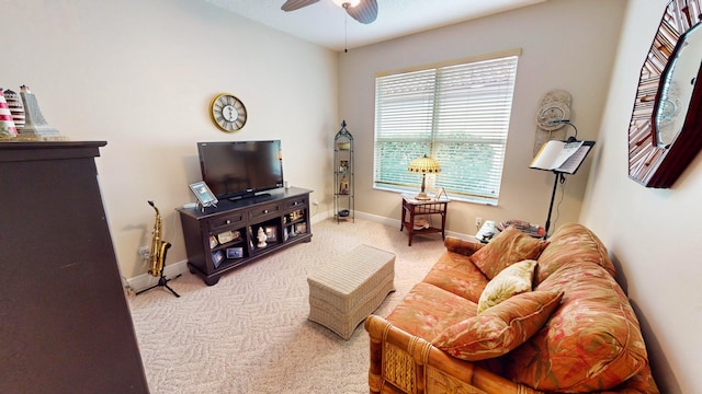 living room with carpet floors and ceiling fan