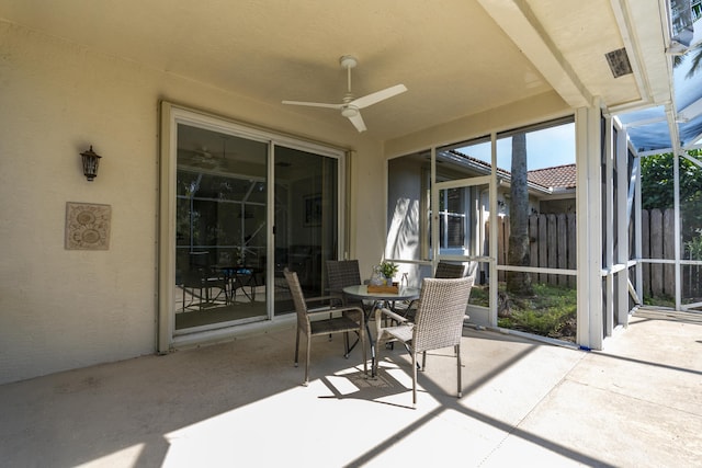 sunroom with ceiling fan