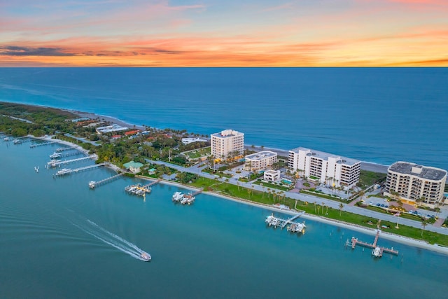 aerial view at dusk with a water view