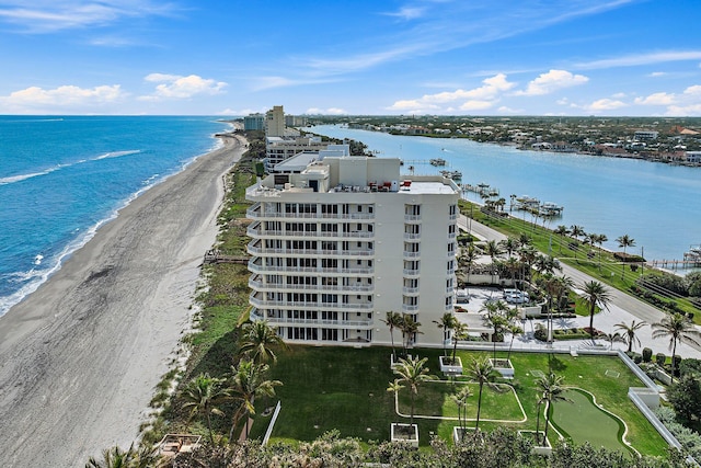 birds eye view of property featuring a water view and a view of the beach