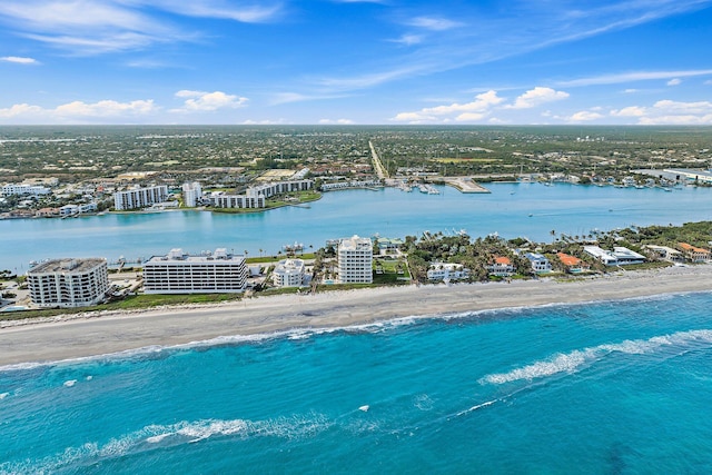 bird's eye view featuring a water view and a view of the beach