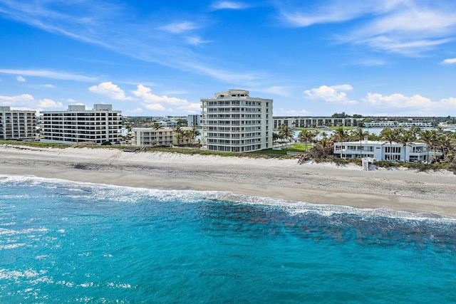 bird's eye view featuring a view of the beach and a water view