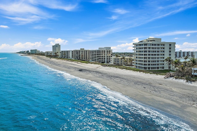 drone / aerial view with a view of the beach and a water view