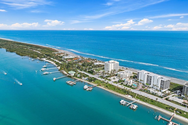 birds eye view of property featuring a view of the beach and a water view