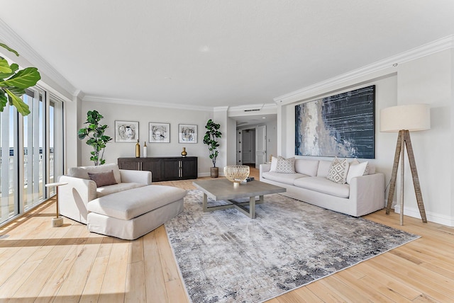 living room featuring hardwood / wood-style flooring and crown molding