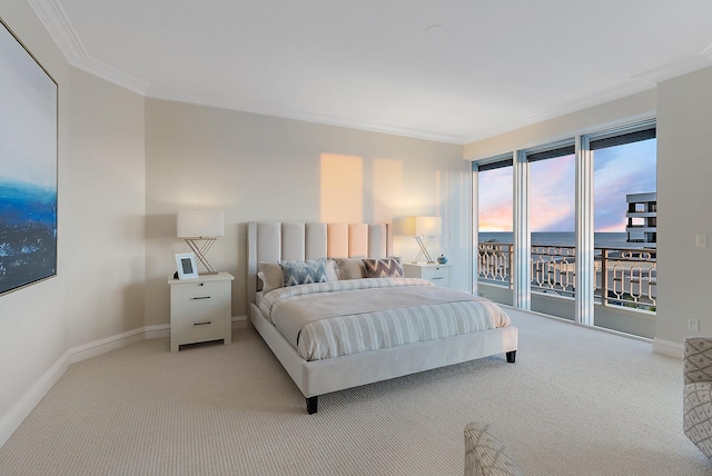 bedroom with a water view, crown molding, light carpet, and access to outside