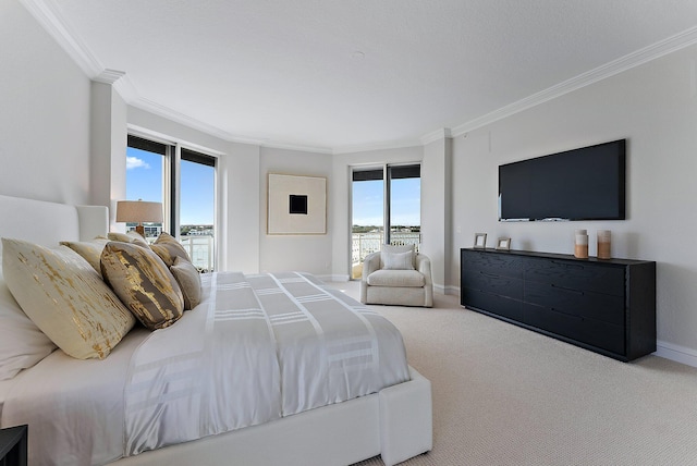 carpeted bedroom with multiple windows, access to exterior, and ornamental molding