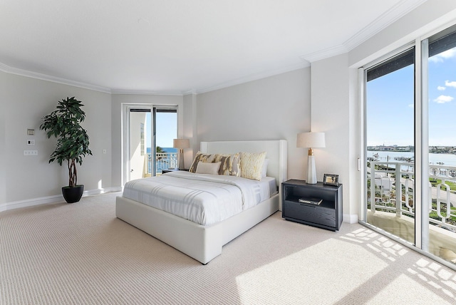 bedroom with a water view, ornamental molding, access to exterior, and carpet