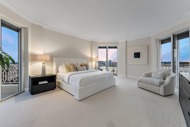 bedroom featuring access to exterior, ornamental molding, and carpet