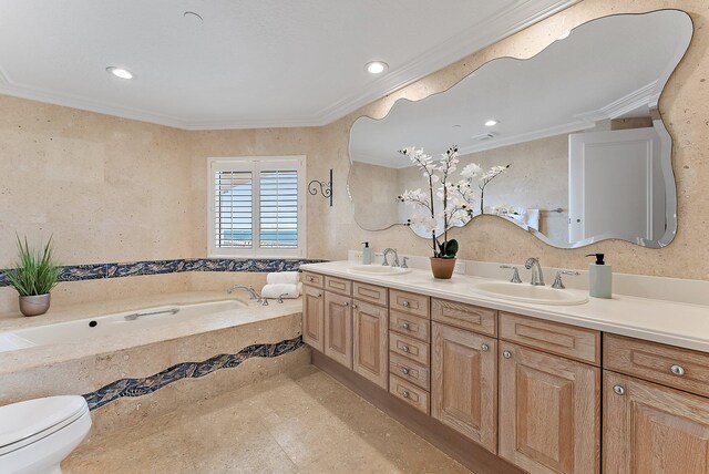 bathroom with ornamental molding, tiled bath, vanity, and toilet