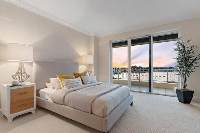 carpeted bedroom featuring a water view, crown molding, and access to outside