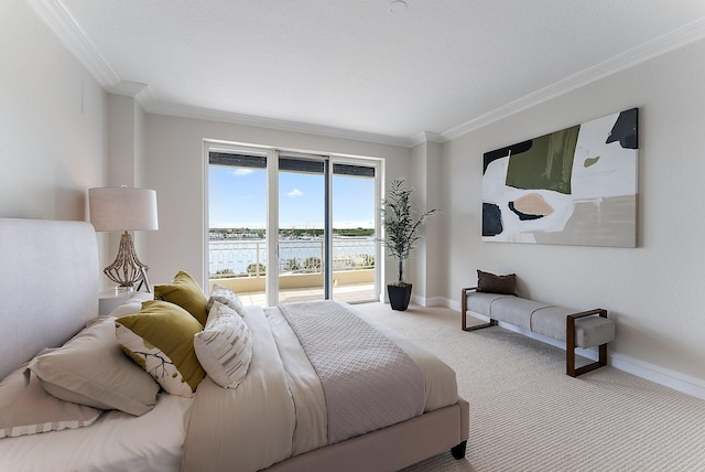 bedroom with crown molding, access to exterior, a water view, a textured ceiling, and light carpet