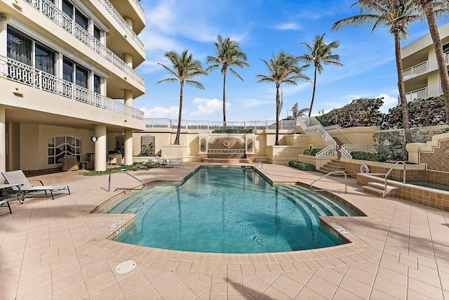 view of swimming pool with a patio area