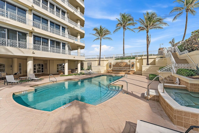 view of pool with a patio area and exterior kitchen