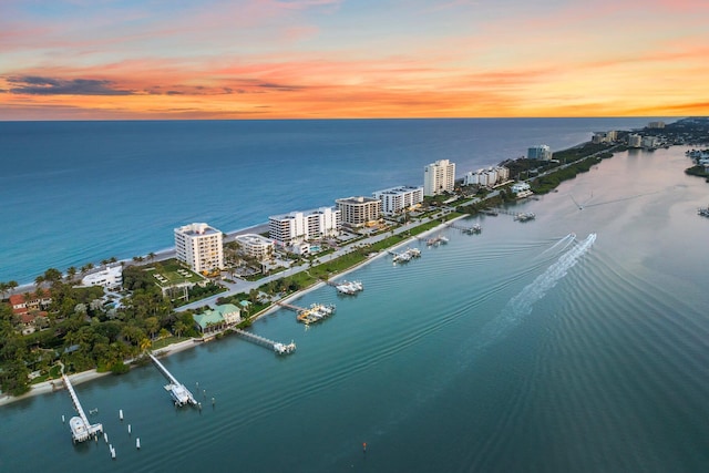 aerial view at dusk with a water view