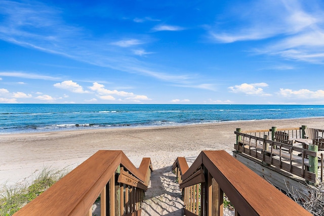 property view of water featuring a beach view