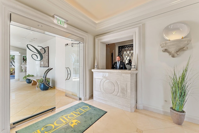 interior space featuring crown molding and tile patterned floors