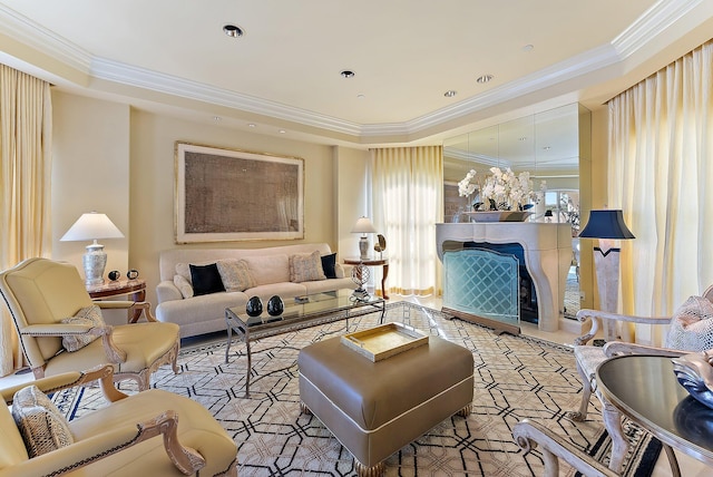 living room featuring crown molding and a fireplace