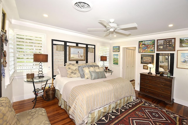 bedroom with recessed lighting, visible vents, baseboards, and wood finished floors