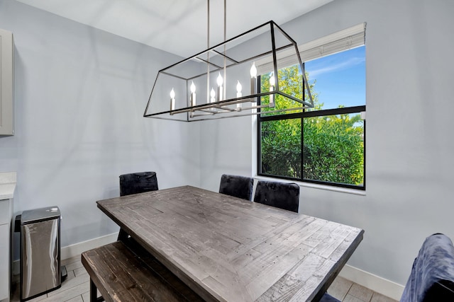 dining space with a chandelier