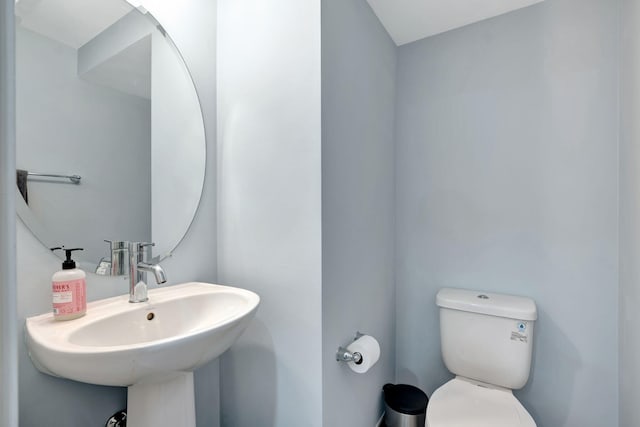 bathroom with sink and toilet