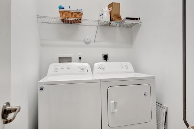 laundry room featuring washer and clothes dryer