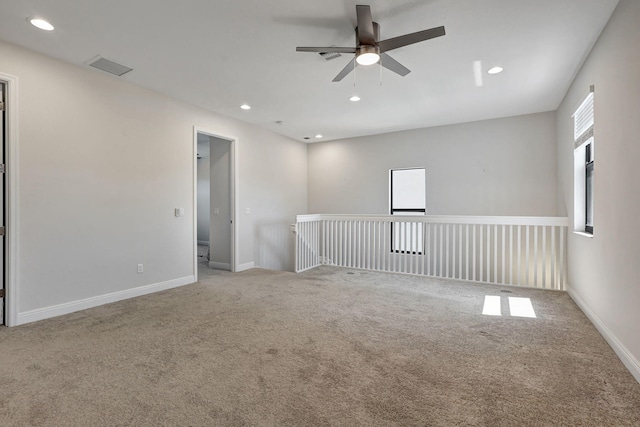 empty room with carpet and ceiling fan