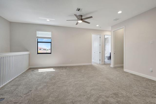 carpeted empty room featuring ceiling fan