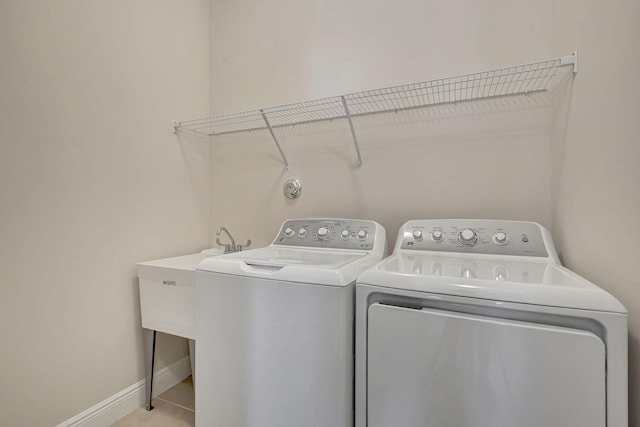 laundry room with washer and clothes dryer