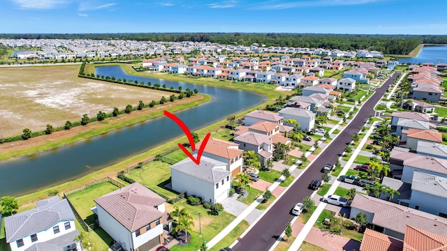 birds eye view of property featuring a water view